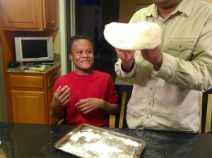I love my son's facial expression as he watches his dad prep the dough. Too cute!