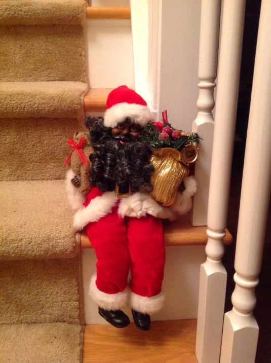 One of several Santa's that rests on the staircase.
