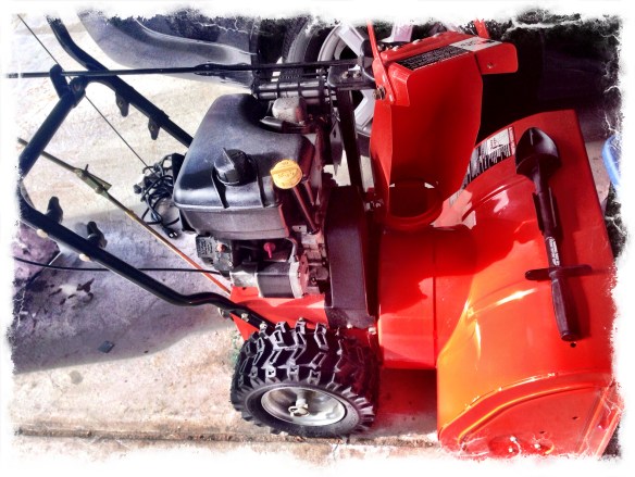 Hubby's snow thrower nesting in the garage.
